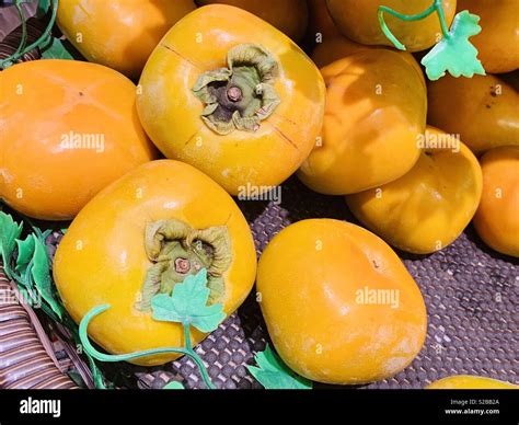 Persimmons fruits hi-res stock photography and images - Alamy