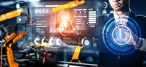 Factory worker control robotic arm in factory | Premium Photo