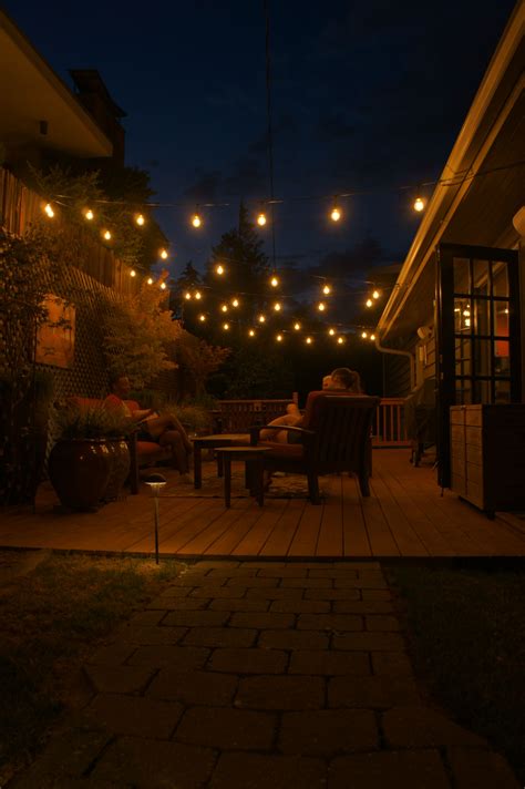 Patio with Bistro Lights for Summer Enjoyment