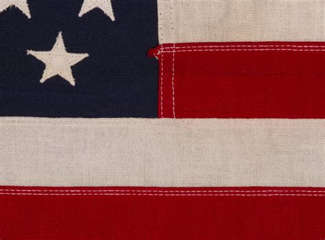 49 STAR AMERICAN FLAG IN A SMALL SCALE AMONG ITS COUNTERPARTS WITH ...