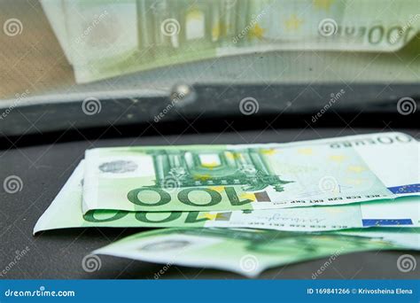 Euro Banknotes on the Dashboard and Their Reflection in the Windshield ...