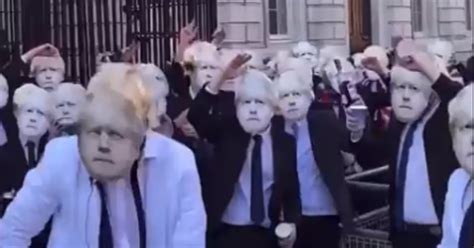 Watch video: Hundreds of people party outside Downing Street wearing ...