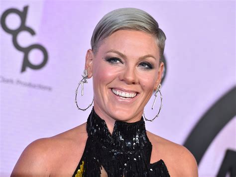 Pink poses naked in great outdoors