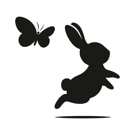 Black silhouette of a rabbit jumping with a butterfly flying above ...