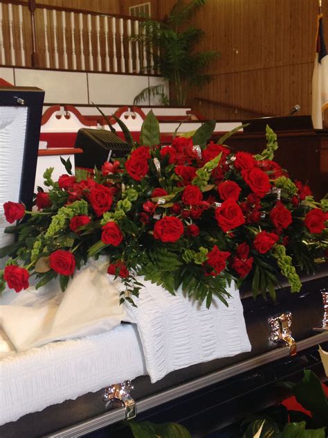 All red rose with rhinestone casket spray. Designs by Alondria, Houston ...