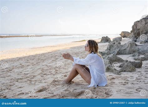 Young Woman Sitting on the Beach Alone, Relax and Enjoy Nature. Stock ...