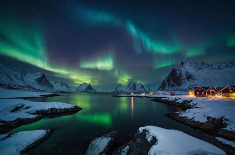 The aurora borealis is visible above the water | Premium AI-generated image