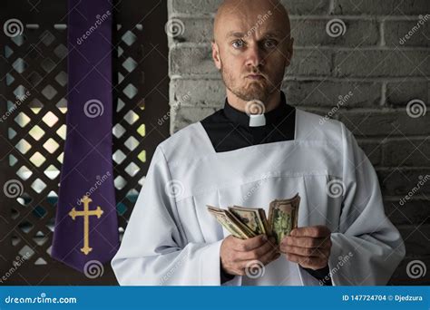 Catholic Priest Counting Money in His Hand Stock Photo - Image of ...