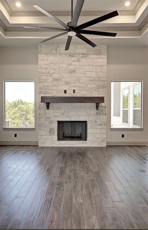 Modern Farmhouse Living Room with Tall Ceiling and White Stone Fireplace