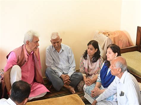 J&K LG Manoj Sinha meets family of ADDC Raj Kumar Thapa, who died in ...