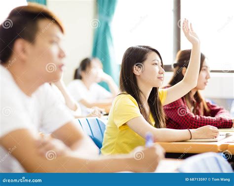College Student Raise Hand for Question in Classroom Stock Image ...