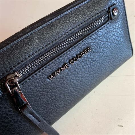 Wayne Cooper black purse(s)