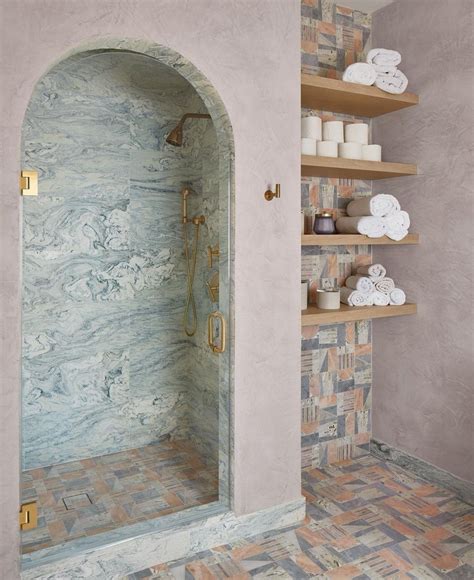 Faded red brick herringbone outdoor shower design river rock shower ...