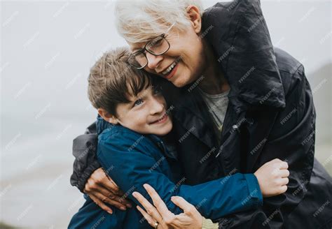 Happy grandmother hugging her grandson | Premium Photo