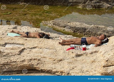 Men sunbathing, Lebanon editorial stock image. Image of corniche - 42976109