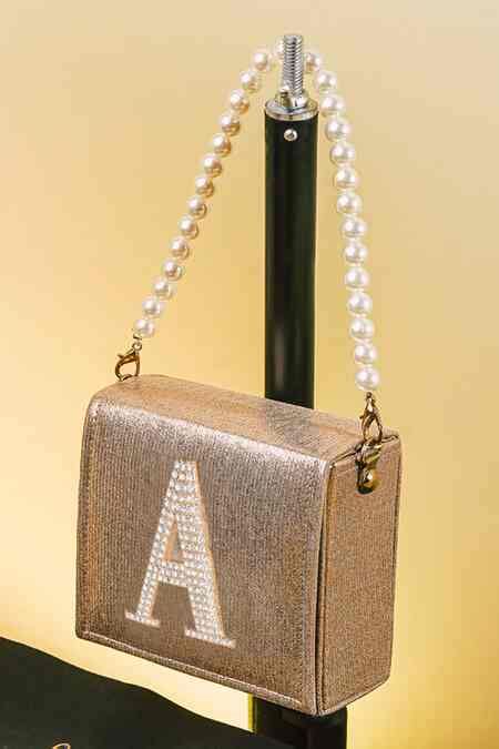 Buy Gold Crystal A Letter Embellished Clutch by NR BY NIDHI RATHI ...