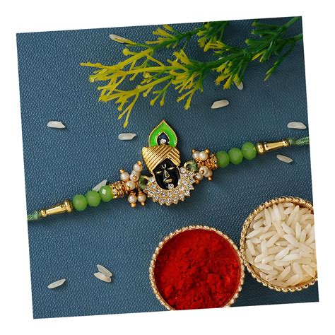 eCraftIndia Green & Golden Lord Shrinathji Religious Rakhi with Roli ...