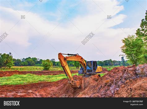 Image result for Backhoe Digging Hole