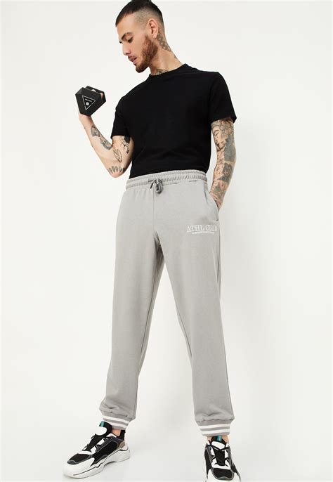 Buy Men Regular Fit Solid Athleisure Joggers Online at just Rs. 999.0 ...