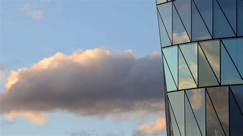 Download wallpaper 1600x900 building, windows, reflection, clouds ...