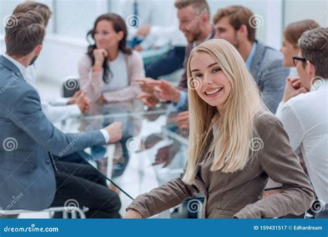 Smiling Young Woman Sitting at Table in Conference Room Stock Image ...