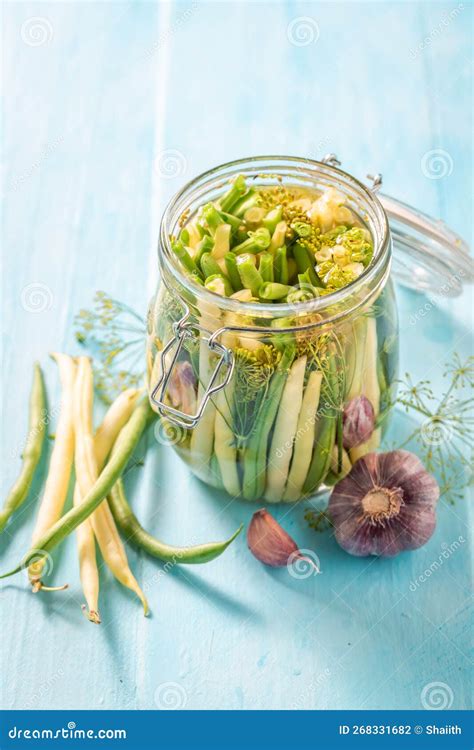 Homemade Pickled Yellow and Green Beans in Jar with Herbs Stock Photo ...