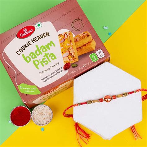 Send Delicate Pearl Rakhi with Haldiram''s Badam Pista Cookies Online