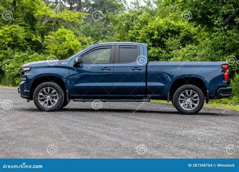 Blue Chevrolet Silverado Pickup Truck Parked in a Lush Green Grassy Field. Editorial Stock Image ...