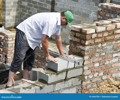 Bricklayer at work stock photo. Image of cement, construction - 5464780