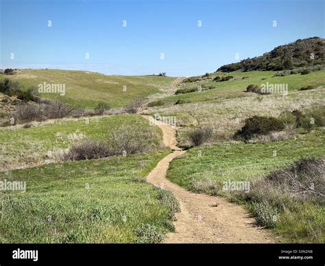 Winding hiking trail across grasslands at Rancho Sierra Vista, Newbury ...