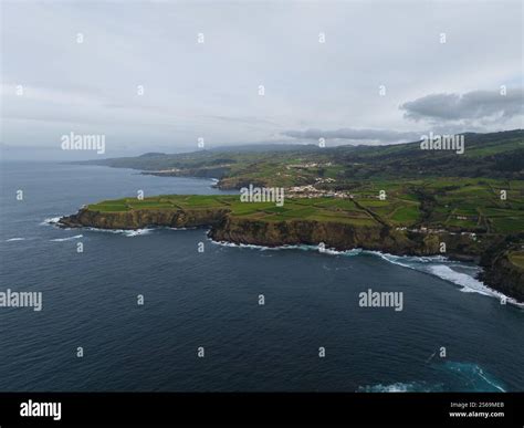 green grassland and rock land landscape of the Azores islands in the Atlantic ocean, touristic ...