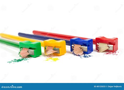 Macro Shot of Green, Yellow, Blue and Red Pencil Sharpeners Sharpening ...