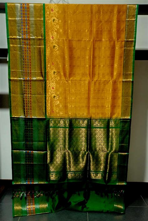Mango yellow with green and zari woven big border Kanchi Kuppadam sare ...