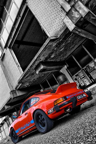 Orange Porsche 911 in front of dilapidated building in black & white by ...