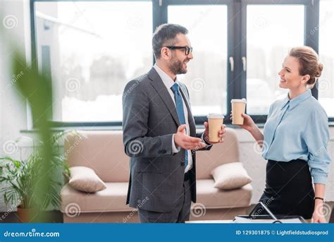 Businesspeople Having Chit-chat while Drinking Coffee Stock Image ...
