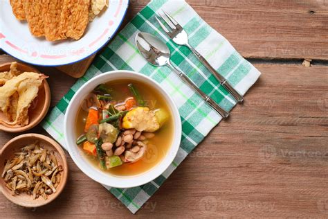 Sayur asam close up in white bowl over wooden table background 5882589 ...