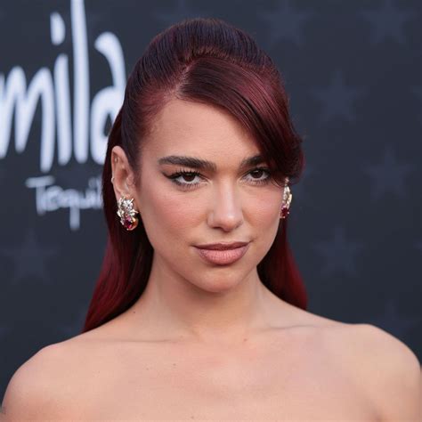 Dua Lipa Flaunts Her Incredible Curves In A Red-Hot Floral Dress For ...