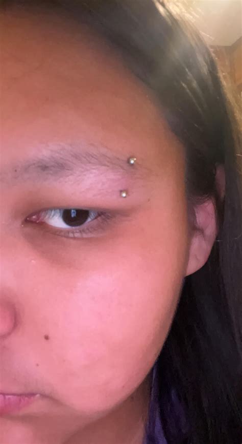 Is my eyebrow piercing infection? : r/PiercingAdvice