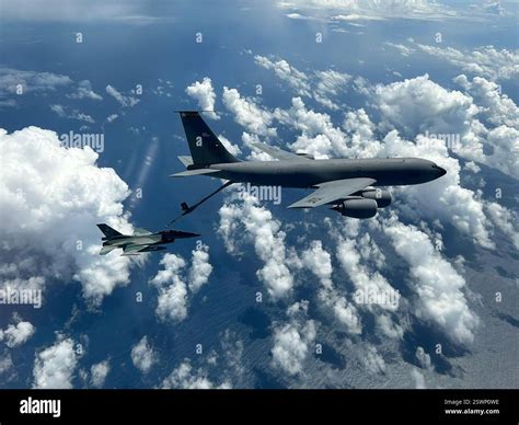 An Indonesian Air Force (IDAF) F-16 Fighting Falcon flies alongside a ...
