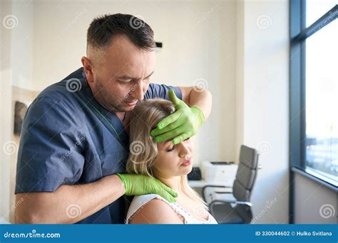 Osteopath Carrying Out Cervical Spine Manipulation, Craniosacral ...