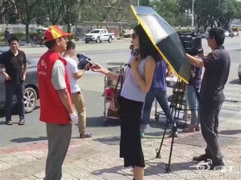 女记者打伞采访：停职并接受进一步处理_厦门现场_厦门_新闻中心_台海网
