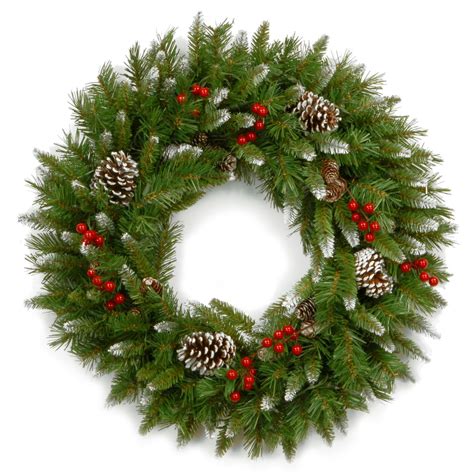 a christmas wreath with pine cones and red berries