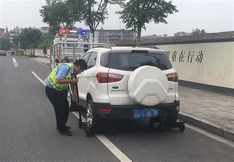 车辆乱停拖走！婺城交警对违法停车动真格-浙江在线金华频道