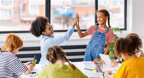 Stock photo 2351257953 - Happy teacher and joyful school kids celebrate ...