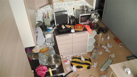 A young man, the freelancer sits at a Desk and working with laptop at ...