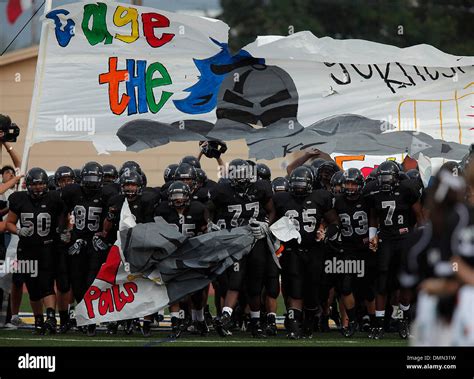 Steele football players bust through their banner before their game ...
