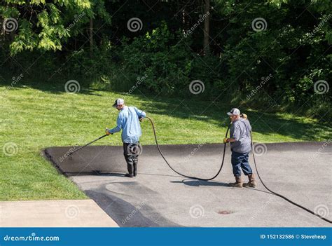 Workers Spraying Blacktop or Asphalt Sealer Onto Roadway Editorial ...