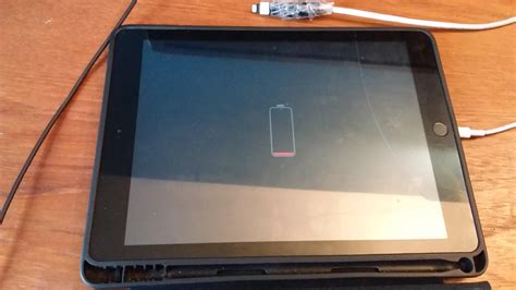 My Ipad has been stuck on this screen for 12 hours. I tried different cables and it won't charge ...