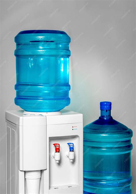 Premium Photo | Water Dispenser with Two Big Water Bottles on the Grey ...