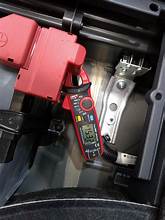 A portable motorcycle jump starter pack, a safe alternative to using a car.